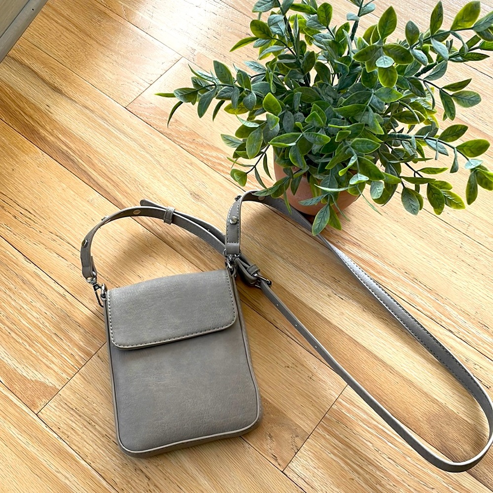 Madison West crossbody purse with adjustable strap.